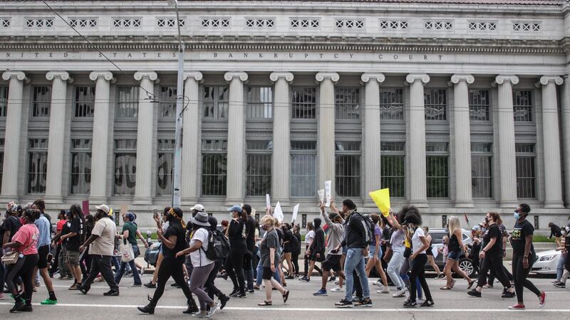 A protest event that began at the Federal Building in downtown Dayton on Saturday, May 30, 2020, moved to the Jones Street and Wayne Avenue area, where police blocked marchers from entering the United States. United 35 using pepper spray balls and a line of officers.  MARSHALL GORBY / STAFF