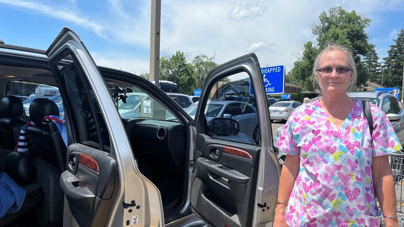 Christine Bledsoe, 60, of Dayton, recently purchased a 2006 GMC Denali. She said new and used car prices are "ridiculous" right now. CORNELIUS FROLIK / STAFF