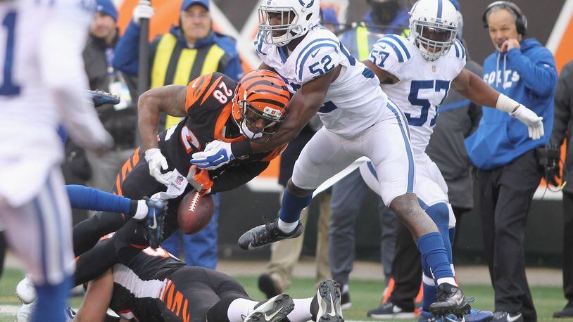 CINCINNATI, OH - OCTOBER 29: Barkevious Mingo #52 of the Indianapolis Colts strips the football from Joe Mixon #28 of the Cincinnati Bengals during their game at Paul Brown Stadium on October 29, 2017 in Cincinnati, Ohio. The Bengals defeated the Colts 24-23. (Photo by John Grieshop/Getty Images)