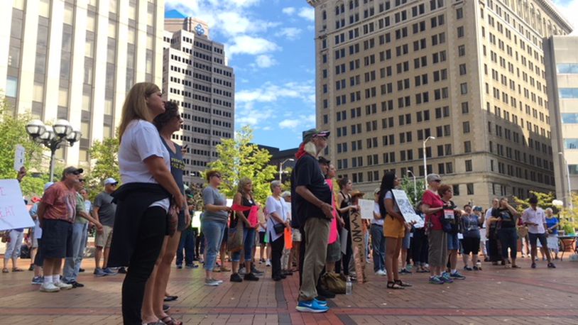 Several dozen protesters gathered in Courthouse Square in downtown Dayton on Saturday, Oct. 6, 2018, ahead of the successful Senate vote to confirm Associate Supreme Court Justice Brett Kavanaugh to the Supreme Court. WILL GARBE / STAFF