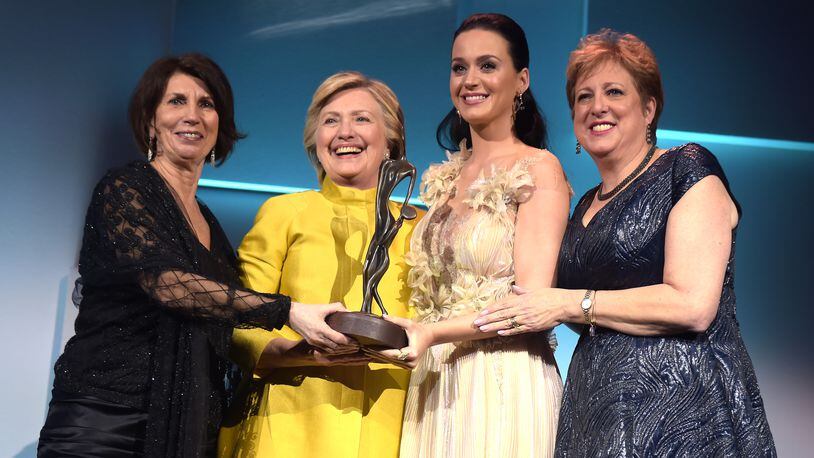 NEW YORK, NY - NOVEMBER 29: (L-R) Pamela Fiori, Hillary Clinton, Katy Perry, and Caryl Stern speak on stage during the 12th annual UNICEF Snowflake Ball at Cipriani Wall Street on November 29, 2016 in New York City. (Photo by Jason Kempin/Getty Images for UNICEF)