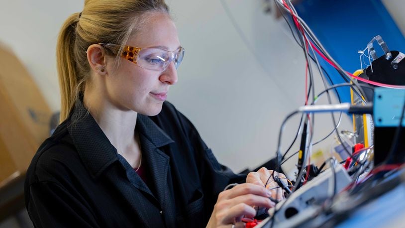 Elyssa Sarajlic, GE Aerospace electronic hardware design engineer, works at the company’s Electrical Power Integrated Systems Center, or EPISCenter in Dayton. GE Aerospace’s investment into its Dayton area facilities in the past two years totals $53.7 million. CONTRIBUTED