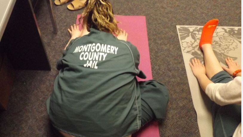 Female inmates at the Montgomery County Jail practice yoga earlier this month. CONTRIBUTED
