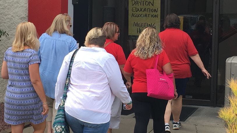 Dayton teachers walk into a union hall Aug. 1 to vote on an upcoming strike. JEREMY P. KELLEY / STAFF