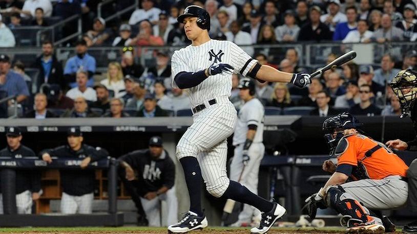 The New York Yankees' Aaron Judge hits an RBI double in the third inning against the Houston Astros in Game 5 of the American League Championship Series at Yankee Stadium in New York on Oct. 18, 2017. (Andrew Savulich/New York Daily News/TNS)