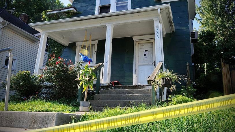 A badly decomposing body found under debris in the detached garage of a Burkhardt Avenue house on Thursday, Aug. 18, 2022, was later identified as 44-year-old CJ Pierce of Dayton, who was reported missing in July. MARSHALL GORBY / STAFF