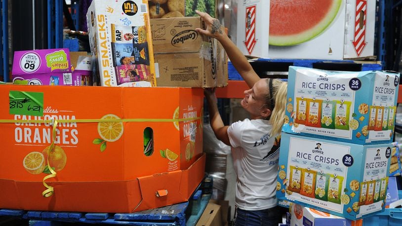 Foodbank employee Carolyn Rife, works in the warehouse Wednesday, June 22, 2022. The Foodbank is getting $3.1 million in aid to help retain their employees. MARSHALL GORBY\STAFF