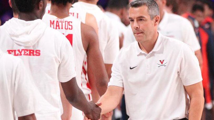 Dayton players shake hands with Virginia coach Tony Bennett after a game on Thursday, Nov. 22, 2018, at Imperial Gym on Paradise Island, Bahamas.