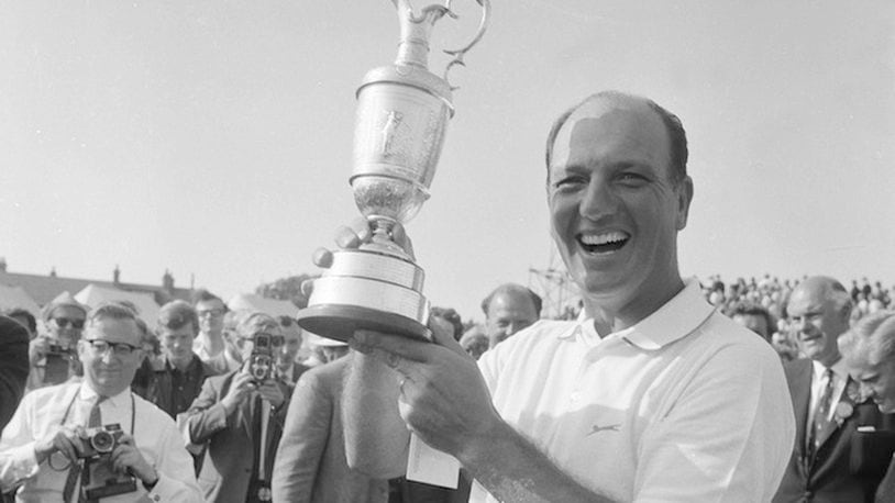 FILE - In this July 15, 1967, file photo, Roberto De Vincenzo of Buenos Aires, Argentina, holds the trophy following his victory at Hoylake, England. De Vincenzo shot a 278 for the 72 holes of championship play. This is the 50-year anniversary of the Argentine winning the British Open. (AP Photo/File)
