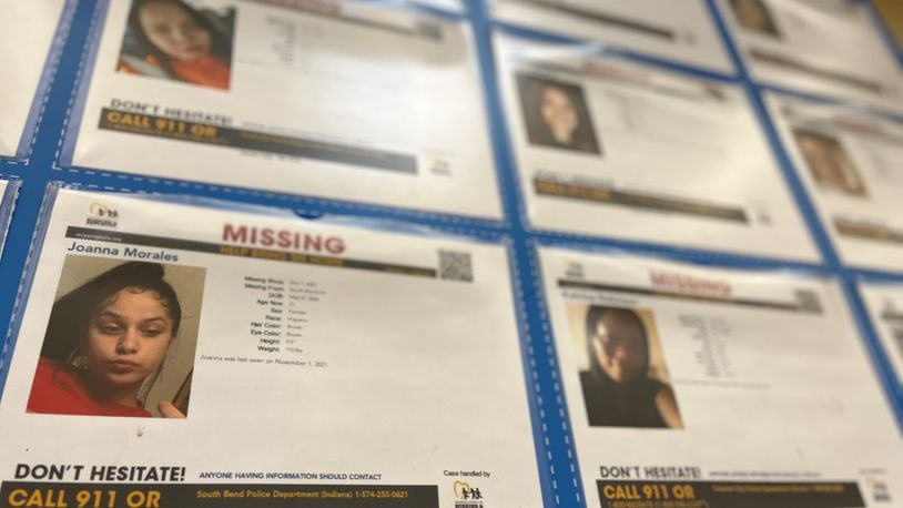A wall of photos of missing kids posted at a Dayton-area box store. CORNELIUS FROLIK / STAFF