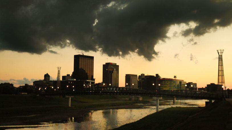 A dramatic cloud cover moved across the Dayton skyline Friday evening as the sun set, part of a front that brought cooler temperatures to the Miami Valley. JIM WITMER / STAFF