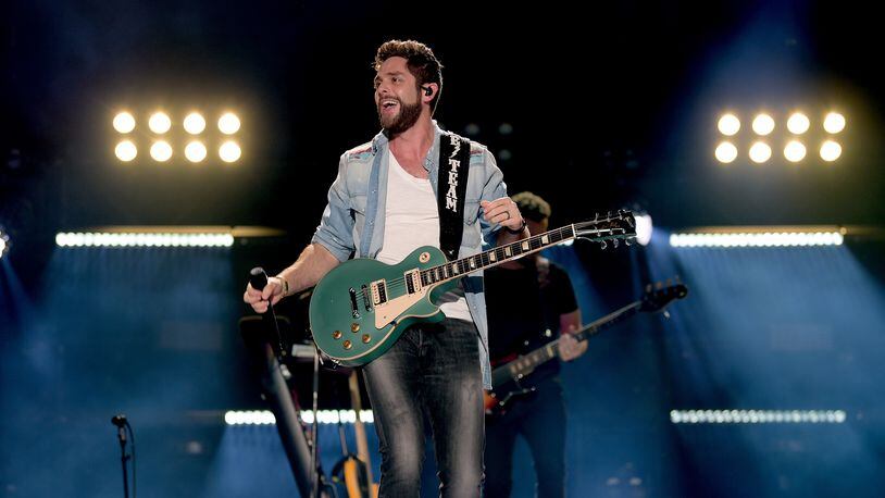 NASHVILLE, TN - JUNE 10:  (EDITORIAL USE ONLY) Thomas Rhett performs onstage during the 2018 CMA Music festival at Nissan Stadium on June 10, 2018 in Nashville, Tennessee.  (Photo by Jason Kempin/Getty Images)