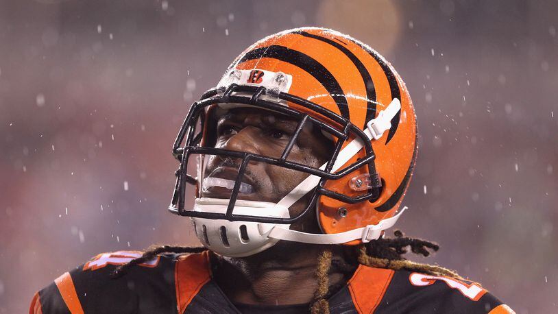 Adam Jones of the  Bengals looks models the Bengals’ stylish helmet before the AFC Wildcard Playoff game against the the Steelers at Paul Brown Stadium on January 9, 2016 in Paul Brown Stadium.