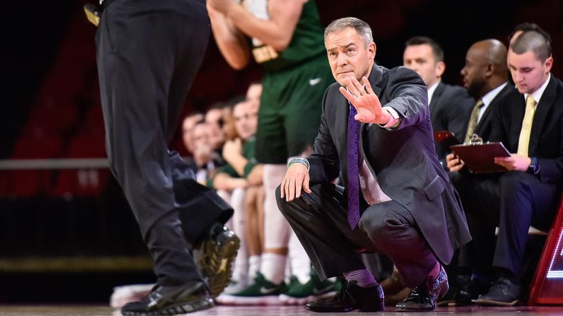 Wright State University head men’s basketball coach Scott Nagy kneels by the court during their game against Miami University Tuesday, Nov. 14 at Millett Hall in Oxford. The Miami University Redhawks basketball team defeated the Wright State Raiders 73-67 in overtime. NICK GRAHAM/STAFF