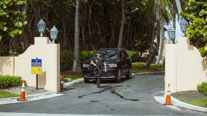 A Secret Service agent guards one of the entrances to former President Trump’s Mar-a-Lago residence in Palm Beach, Fla. on August 9, 2022. An FBI search of the property, according to multiple people familiar with the investigation, appeared to be focused on material that the former president had brought with him to Mar-a-Lago from the White House. (Saul Martinez/The New York Times)