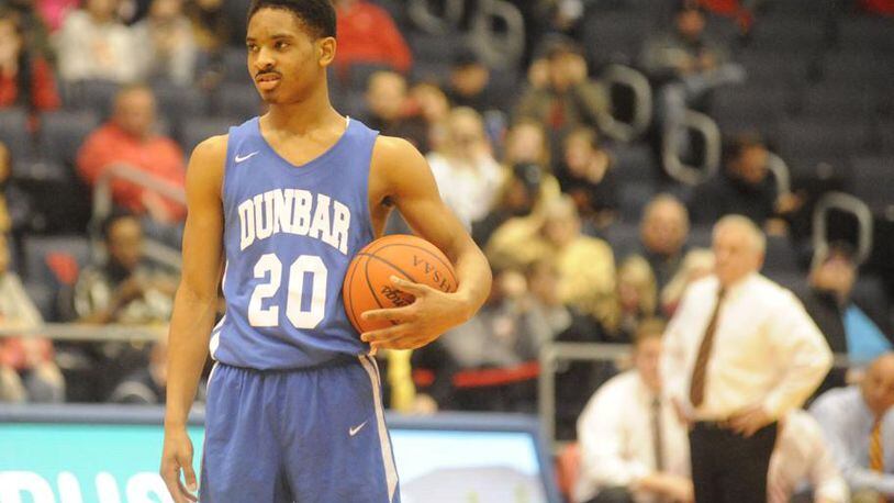 In its tournament game against Fenwick, Michael Elmore and Dunbar played a waiting game, holding the ball for minutes at a time. Now the waiting begins for the fallout from Dunbar’s 2019 postseason tournament ban. MARC PENDLETON / STAFF