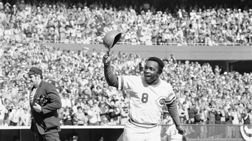 Cincinnati's speedy second baseman Joe Morgan tips his helmet to the fans as he rounds the bases after a homer in the first inning against the Yankees on Saturday, Oct. 16, 1976 in Riverfront Stadium. (AP Photo)