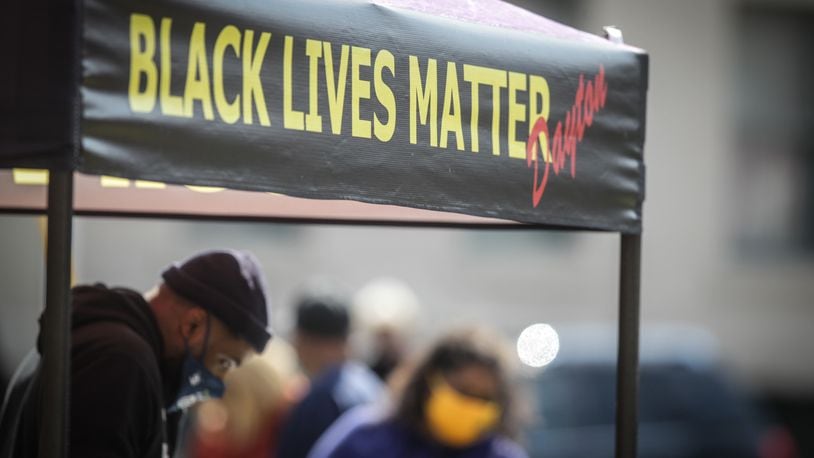 About a dozen community members gathered for a Black Lives Matter rally Wednesday afternoon, April 14, 2021, in Dayton. JIM NOELKER/SAFF