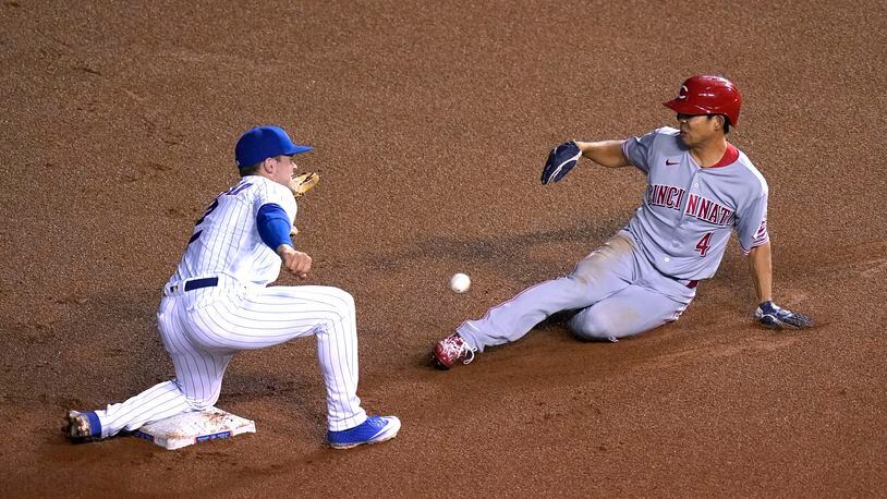 Cincinnati Reds' Shogo Akiyama (4) steals second as Chicago Cubs' Nico Hoerner is unable handle the throw from catcher Willson Contreras during the fourth inning of a baseball game Thursday, Sept. 10, 2020, in Chicago. (AP Photo/Charles Rex Arbogast)