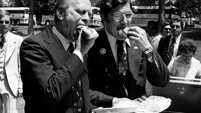Clarence J. “Bud” Brown and then President Gerald Ford eat doughnuts during a campaign stop in Springfield.