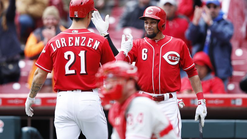 CINCINNATI, OH - APRIL 06: Michael Lorenzen #21 of the Cincinnati Reds is congratulated by Billy Hamilton #6 after hitting a solo home run to break a tie in the sixth inning of the game against the Philadelphia Phillies at Great American Ball Park on April 6, 2017 in Cincinnati, Ohio. (Photo by Joe Robbins/Getty Images)
