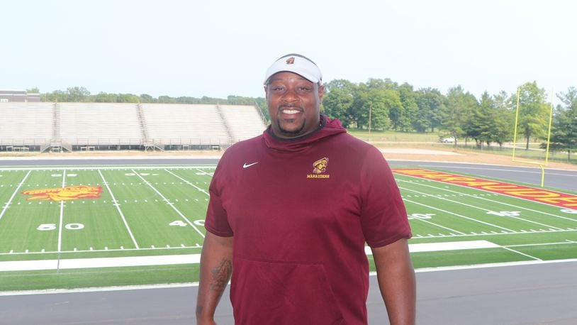 Central State University head football coach Bobby Rome with the new football field at McPherson Stadium behind him. Nick Novy/Central State University
