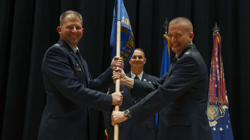 Col. William Fry, right, accepts command of the National Air and Space Intelligence Center’s Air and Cyberspace Intelligence Group from Col. Parker Wright, NASIC commander, in July 2018. (U.S. Air Force photo/ Senior Airman Jonathan Stefanko)