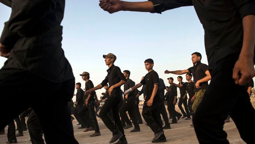 Civilian volunteers during military training to assist Shiite militias loyal to Iran in Kufa, southern Iraq, on June 20, 2014. Qasem Soleimani, the powerful and shadowy spymaster at the head of Irans security machinery, was killed in an American drone strike in Baghdad on early on Friday, Jan. 3, 2020. (Lynsey Addario/The New York Times)
