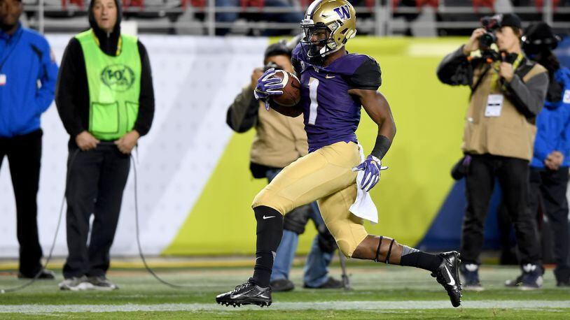 SANTA CLARA, CA - DECEMBER 02: John Ross #1 of the Washington Huskies runs in for a touchdown against the Colorado Buffaloes during the Pac-12 Championship game at Levi’s Stadium on December 2, 2016 in Santa Clara, California. (Photo by Thearon W. Henderson/Getty Images)