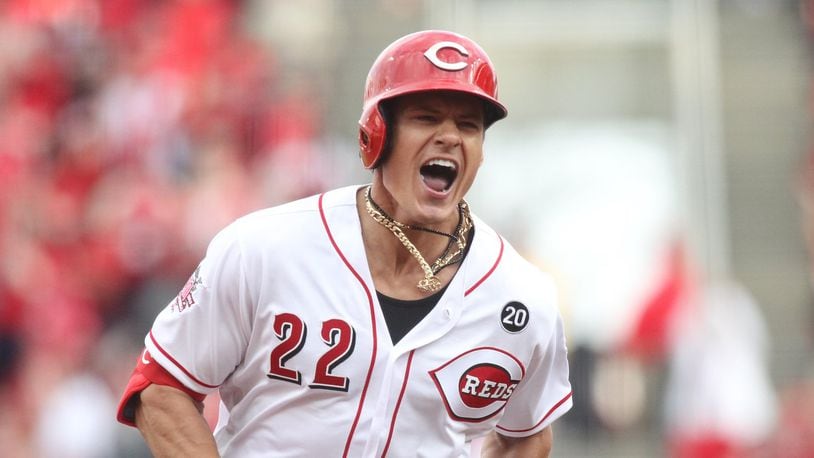 The Reds’ Derek Dietrich reacts after hitting a three-run, tie-breaking home run in the eighth inning against the Pittsburgh Pirates on Opening Day on Thursday, March 28, 2019, at Great American Ball Park in Cincinnati.