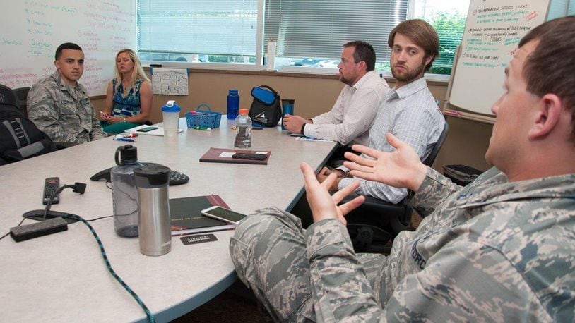 First Lt. Connor Wiese (right), a development engineer with Team Wright-Patt, proposes an idea to his team during a brainstorming session Aug. 2 as part of the Air Force Research Laboratory Commander’s Challenge 2017. The challenge brings Airmen together from a wide-range of specialties to tackle a real-world problem with a maximum budget of $50,000 and six months to develop a working demonstration. (U.S. Air Force photo/John Harrington)