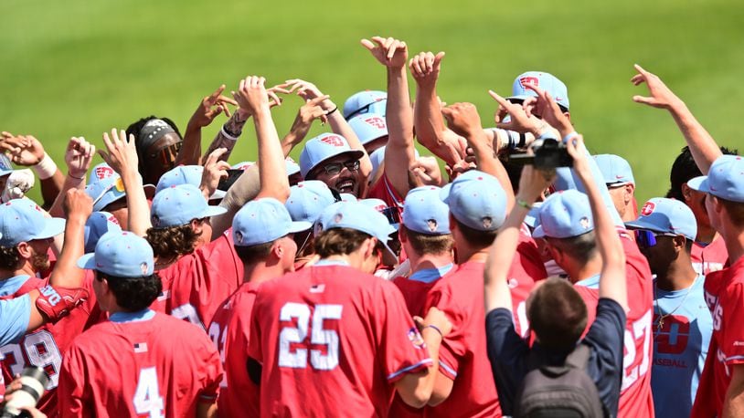 The Dayton baseball team huddles during a game against Davidson at Day Air Ballpark in 2024. Photo by Erik Schelkun