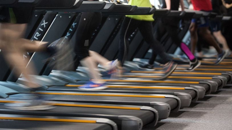 People run on treadmills to exercise during a workout session. Bloomberg photo by Simon Dawson