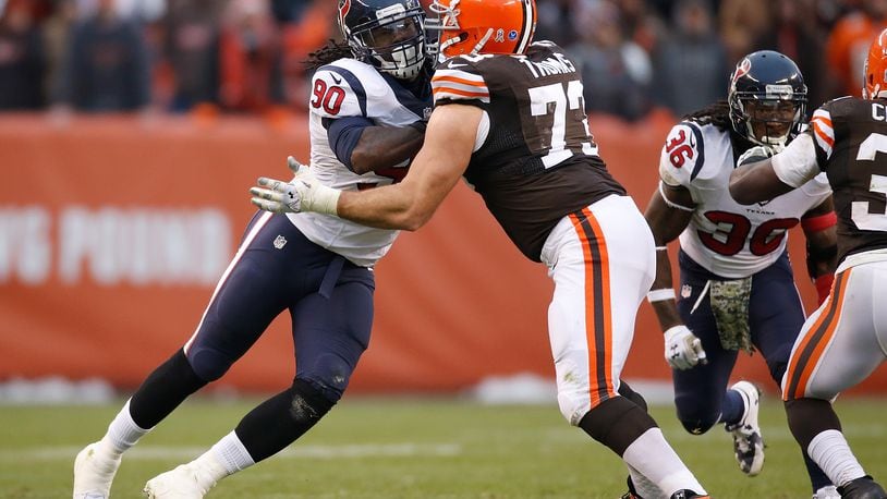 CLEVELAND, OH - NOVEMBER 16:  Jadeveon Clowney #90 of the Houston Texans tries to get past Joe Thomas #73 of the Cleveland Browns during the fourth quarter at FirstEnergy Stadium on November 16, 2014 in Cleveland, Ohio.  (Photo by Gregory Shamus/Getty Images)