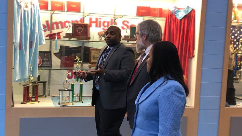 Belmont High School Principal Donetrus Hill (left) leads a tour of the school for state Superintendent Paolo DeMaria and Dayton Public Schools Treasurer Hiwot Abraha. DeMaria toured several Dayton schools on Tuesday, Feb. 26, 2019. JEREMY P. KELLEY / STAFF