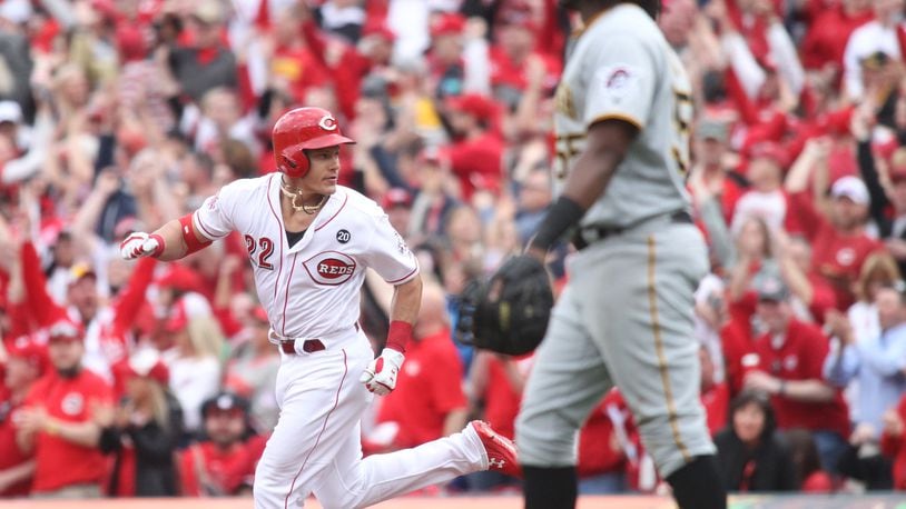 The Reds' Derek Dietrich rounds the bases after a three-run home run against the Pirates on Opening Day on Thursday, March 28, 2019, at Great American Ball Park in Cincinnati.