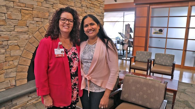 Tracy Adrian, a Breast Health Navigator with MercyHealth, left, and Dr. Jyothi Challa, an oncologist with MercyHealth, an the Springfield Cancer Center Tuesday, Sept. 27, 2022. BILL LACKEY/STAFF