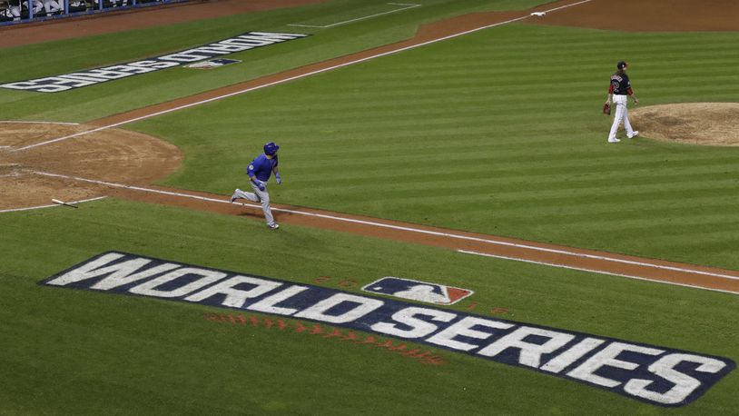 Chicago Cubs' Anthony Rizzo hits a two-run home run during the ninth inning of Game 6 of the Major League Baseball World Series against the Cleveland Indians Tuesday, Nov. 1, 2016, in Cleveland. (AP Photo/David J. Phillip)