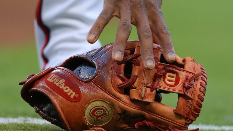 April 18, 2018 Atlanta: Atlanta Braves second baseman Ozzie Albies grabs his glove to begin the first inning against the Phillies in a MLB baseball game on Wednesday, April 18, 2018, in Atlanta. Curtis Compton/ccompton@ajc.com