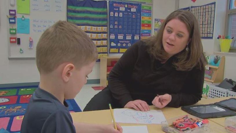 Meghan Bykowski and son, Luke, color in his kindergarten class. 
(WPXI)