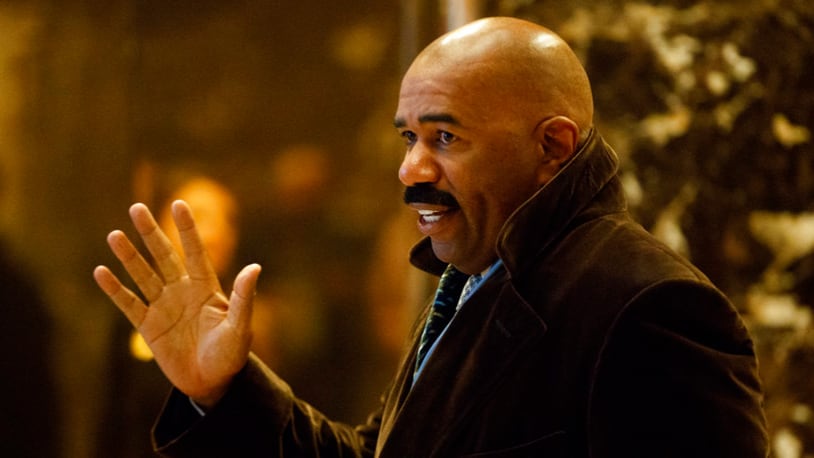 FILE - In this Jan. 13, 2017 file photo, Comedian Steve Harvey arrives in the lobby of Trump Tower in New York to meet with President-elect Donald Trump. Apologies are being demanded from Harvey following comments about Flint's lead-tainted water crisis. Flint resident Dee Smith says Harvey told him to "enjoy your brown cup of water" during a Wednesday June 14, 2017 call-in to Harvey's radio show. (AP Photo/Evan Vucci)