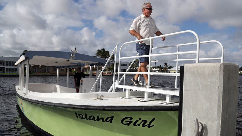 Pompano Beach Water Taxi co-owner Jeff Torode is shown aboard the “Island Girl” in Pompano Beach on Wednesday, Nov. 29, 2017. (Amy Beth Bennett/Sun Sentinel/TNS)