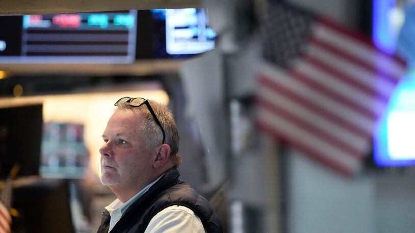 Traders work on the floor at the New York Stock Exchange in New York, Wednesday, May 1, 2024. (AP Photo/Seth Wenig)
