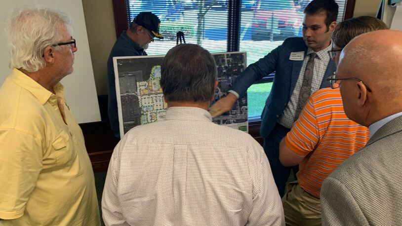 An open house was held Thursday night to discuss a well-known local developer’s $146 million plan called Centerville Place that city officials say will bring new energy to the city and help invigorate its economy. Economic Development Administrator Michael Norton-Smith meets with residents. STAFF