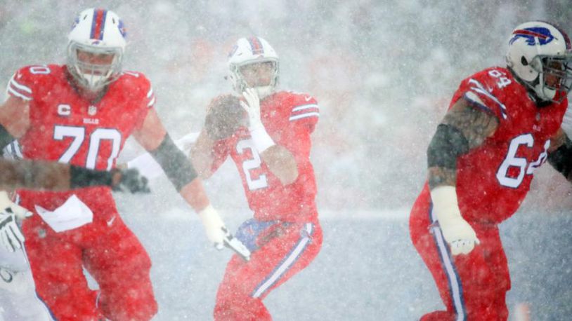 Buffalo quarterback Nathan Peterman tries to throw a pass during the second quarter Sunday. Snowy conditions made visibility difficult during the game.