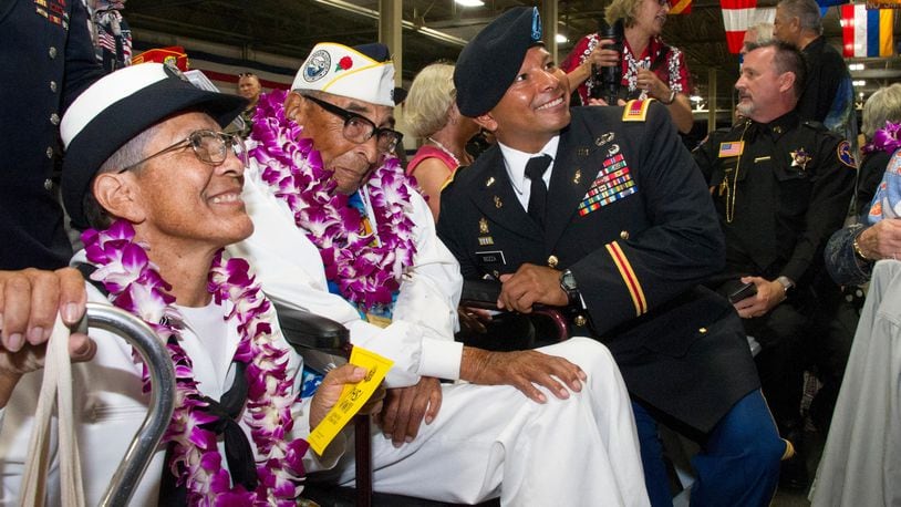FILE PHOTO: Pearl Harbor survivor Ray Chavez (C) sits with his daughter Kathleen Chavez (L) and Chief Warrant Officer 4 Dorian Bozza (R) during a ceremony commemorating the 75th anniversary of the attack on Pearl Harbor at Kilo Pier on December 07, 2016 in Honolulu, Hawaii. Chavez is attending Memorial Day ceremonies in Washington, D.C.
