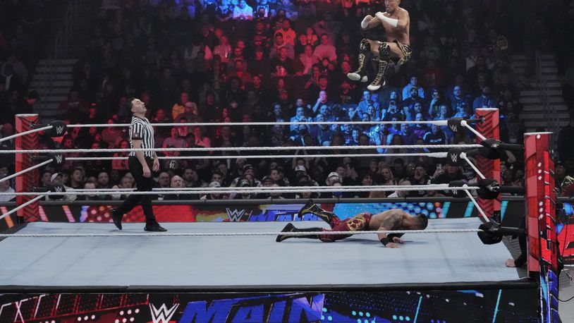 Wrestler Akira Tozawa goes airborne during his match with Carmelo Hayes during the WWE Monday Night RAW event, Monday, March 6, 2023, in Boston. WWE’s popular television show, “Friday Night Smackdown,” will be moving from Fox to USA Network next year under a new five-year domestic media rights partnership with NBCUniversal, Thursday, Sept. 21, 2023. “Smackdown” will begin airing on USA Network in October 2024.(AP Photo/Charles Krupa)