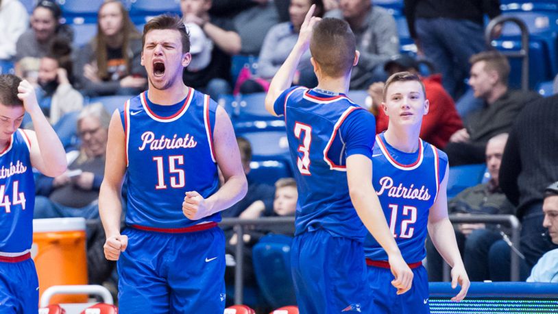 Tri-Village’s Gavin Richards (left) yells as players celebrate a Division IV district final victory over Jackson Center on Friday night at UD Arena. BRYANT BILLING / CONTRIBUTED