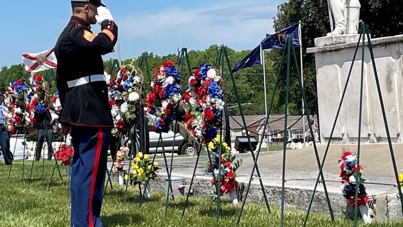 Members representing each branch of the military services set wreaths during Memorial Day ceremonies Monday at the Dayton National Cemetery. NICK BLIZZARD/STAFF