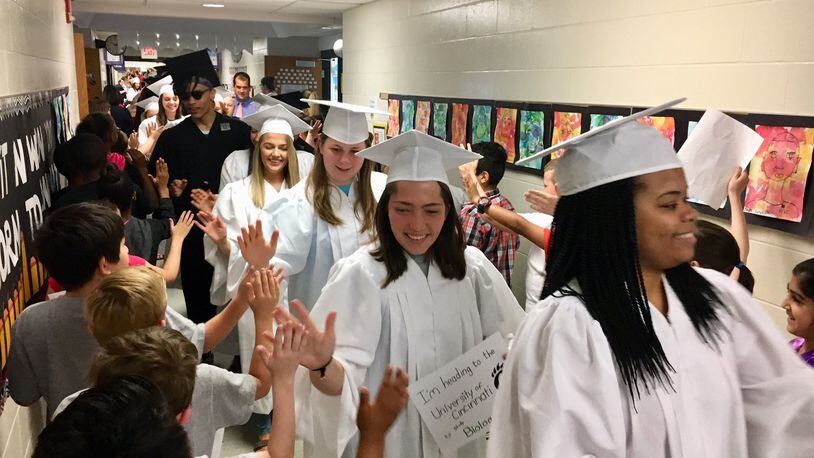 Dozens of graduating Lakota East High School seniors paraded through cheering youngsters at Woodland Elementary recently as part of a recent and popular spring tradition at Lakota Schools. All 10 of Lakota’s elementary schools put on parades for seniors from both Lakota East and Lakota West.